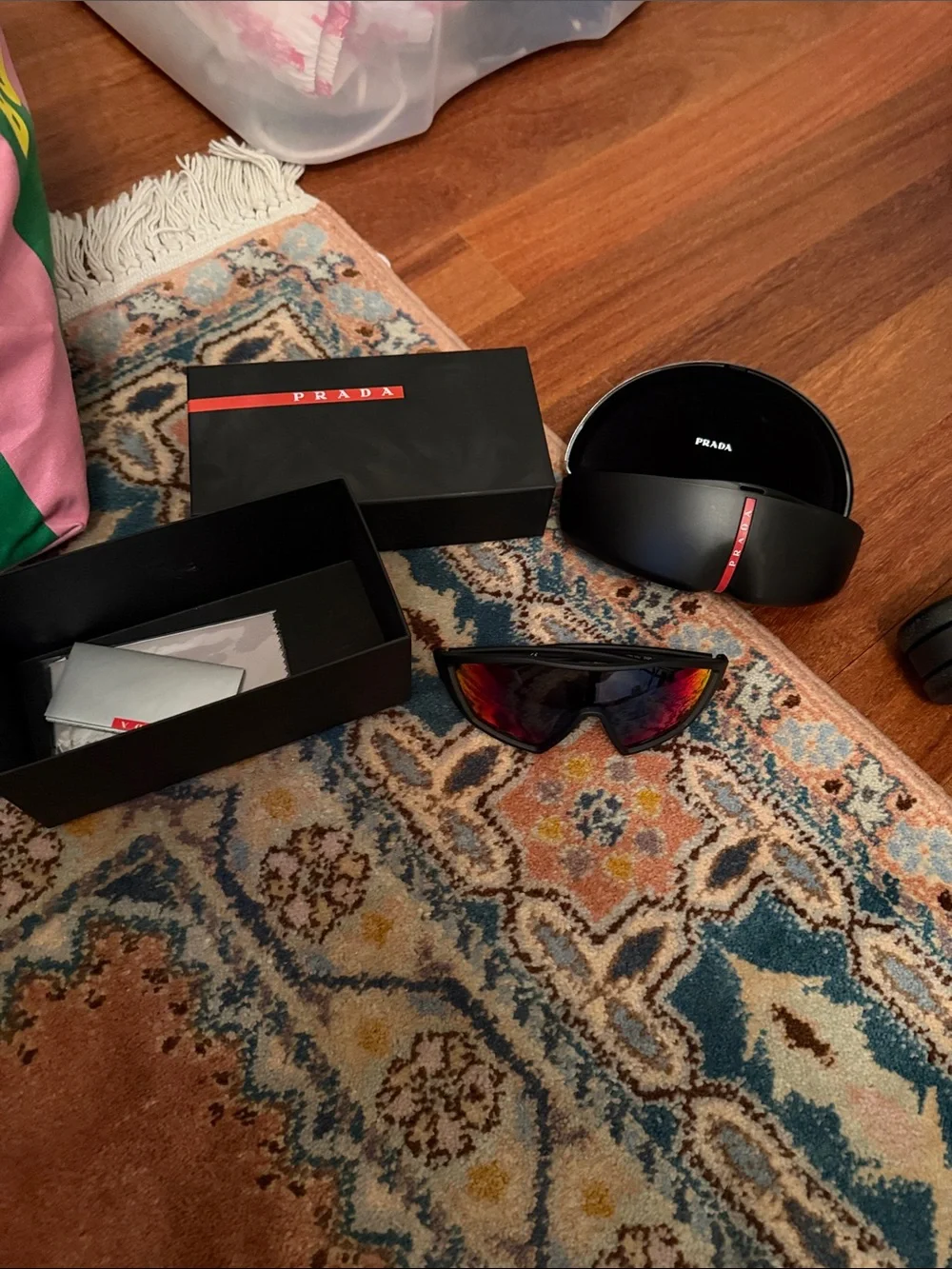 Prada Black Frame Sunglasses with Red Mirrored Lenses